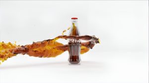 3D illustration of a Coca-Cola ad frame featuring a dynamic liquid simulation effect.